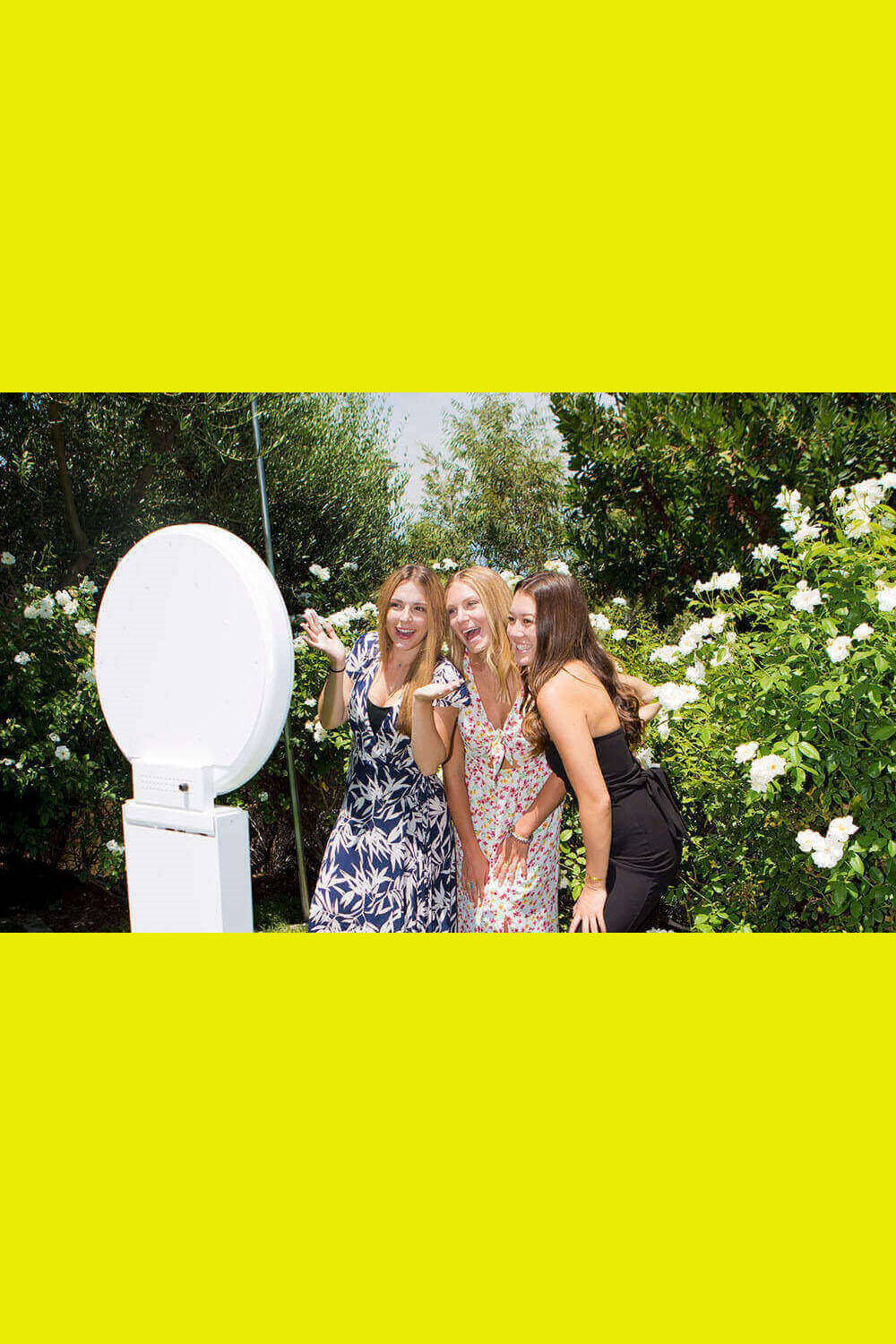 Three girls know how to have fun with this San Fernando Valley selfie station.